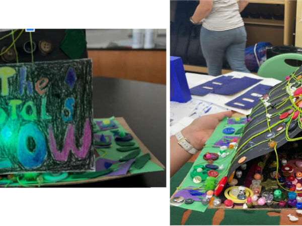 There are two pictures. The picture on the left shows a a piece of construction paper folded in half, sitting on top of a piece of cardboard. The folded paper is colored black, with hand-written letters in different colors spelling Let the Crystals Glow. A green LED light is illuminated. The cardboard platform is decorated with construction paper and colorful beads. The picture on the right shows the inside of the paper cave and is filled with colored beads and buttons.